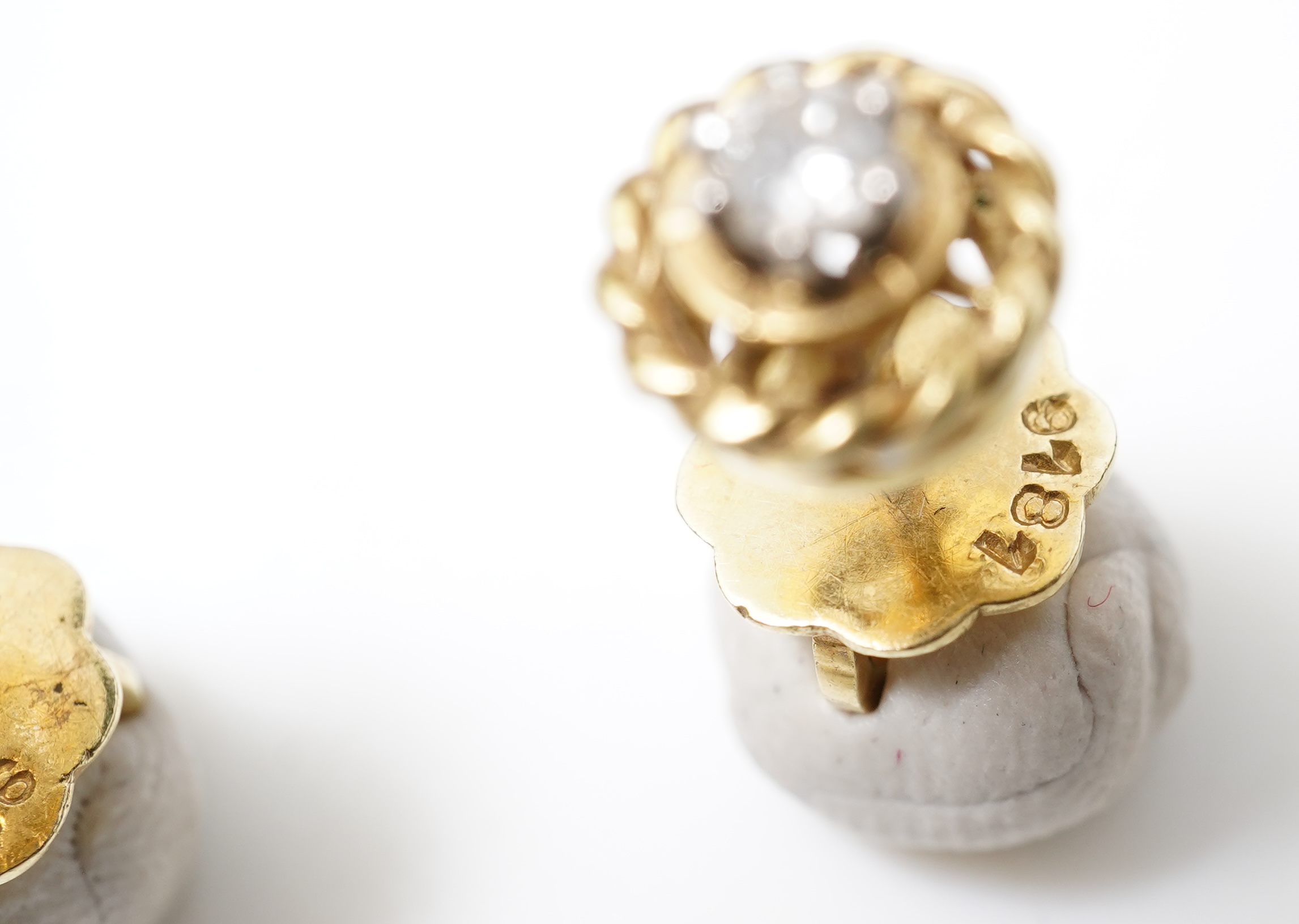 A pair of diamond stud earrings